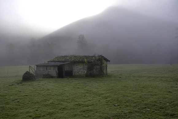 Farm hut in AM fog on AS-262 to Covadonga