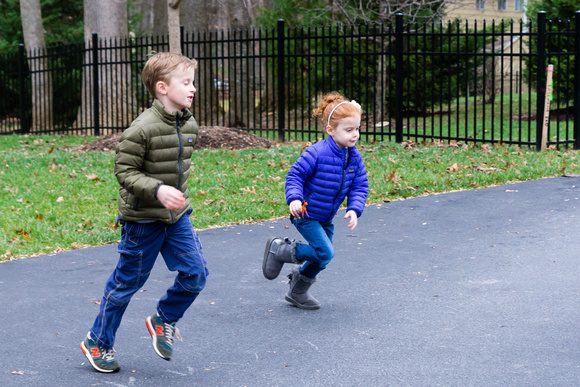 Jackson and Hayley chasing the soccer ball