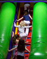 Climbing the big slide at Bouncetown