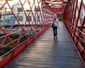 Karen crossing Pont de les Peixateries Velles - pedestrian bridge in Girona